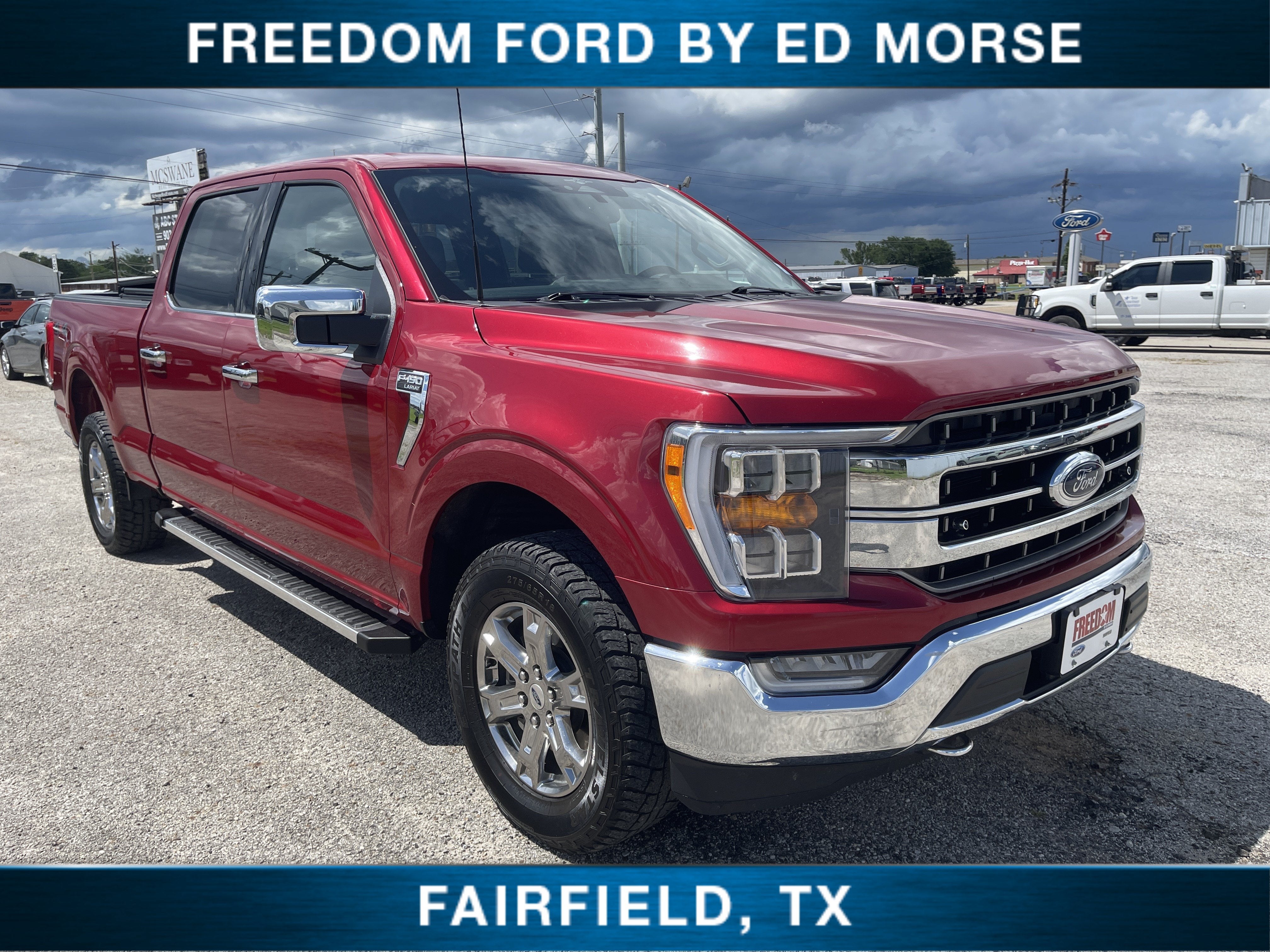 2023 Ford F-150 LARIAT in Red Metallic — front three-quarter view