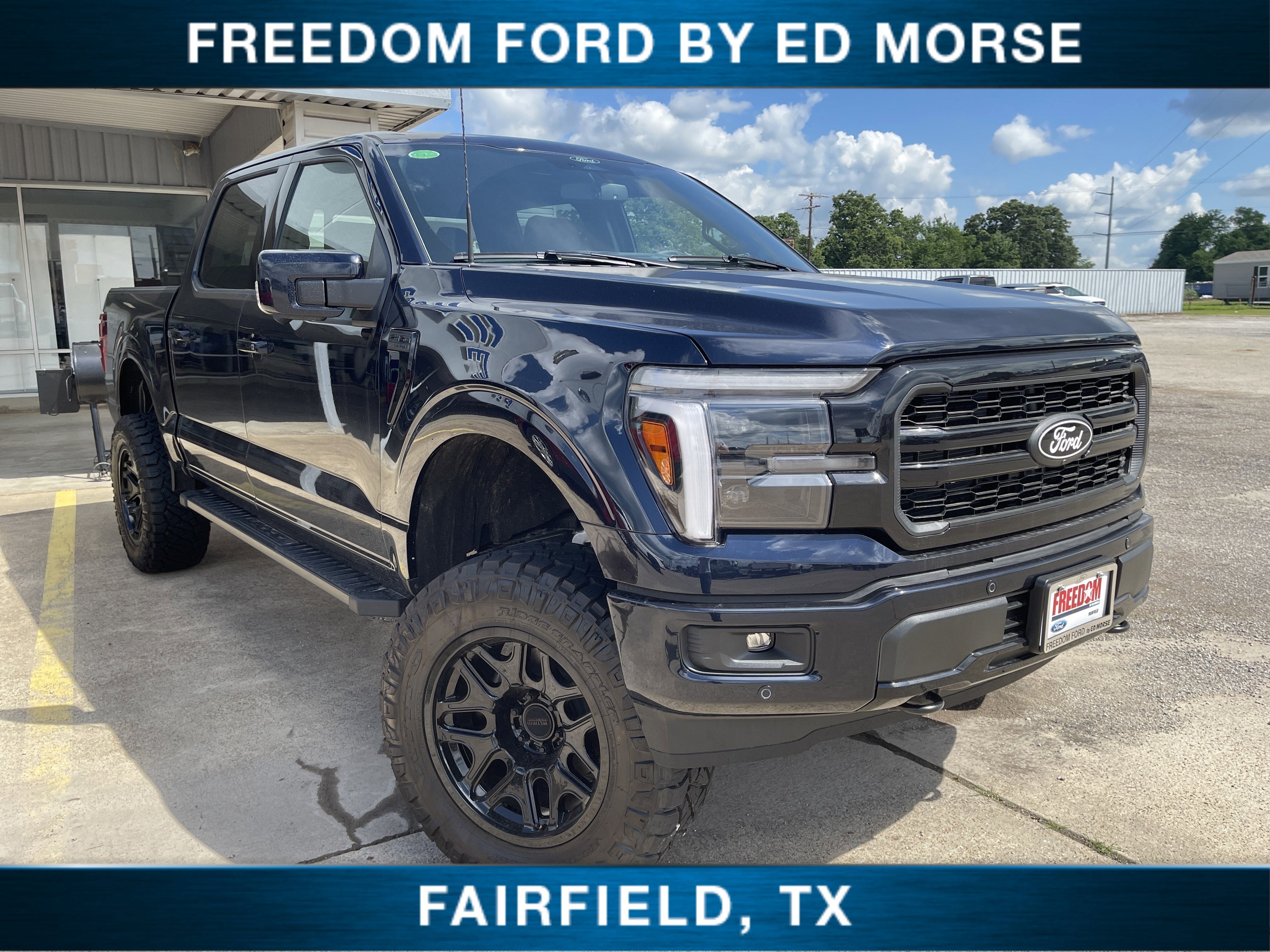 2026 Ford F-150 LARIAT in Antimatter Blue Metallic — front three-quarter view