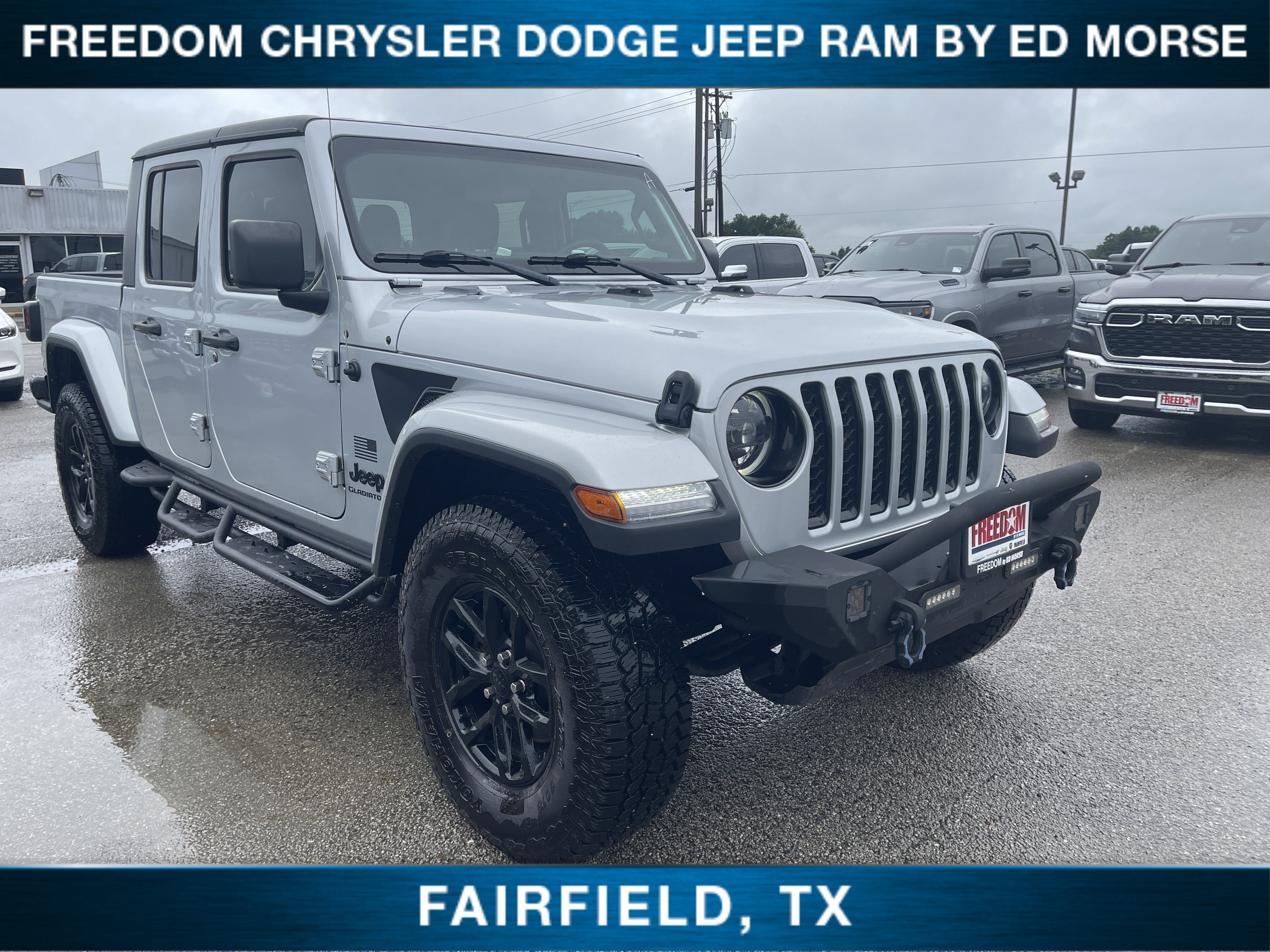 2023 Jeep Gladiator Freedom in Silver Zynith Clearcoat — front three-quarter view
