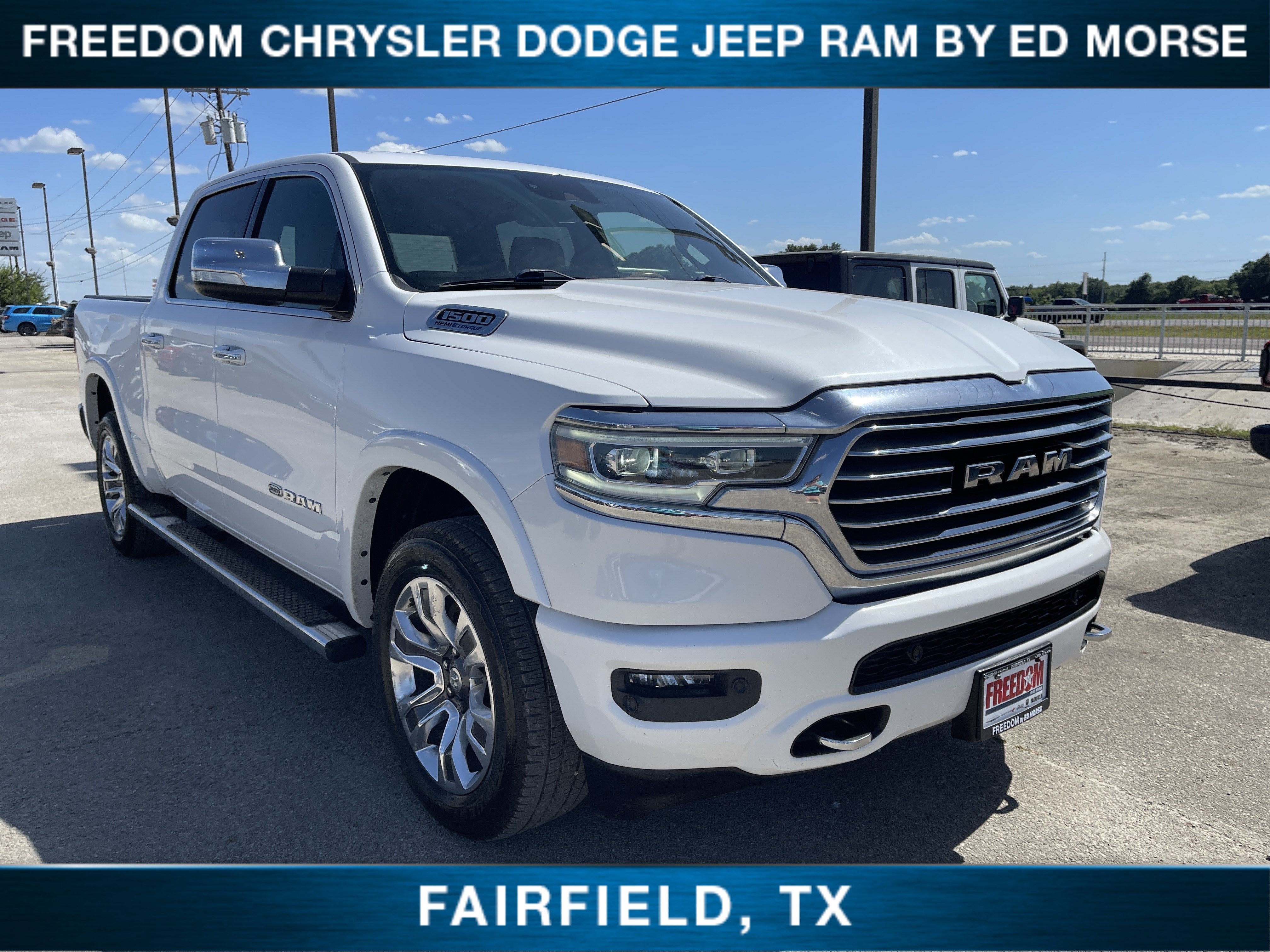 2021 RAM 1500 Longhorn in Ivory White Tri-Coat Pearlcoat — front three-quarter view