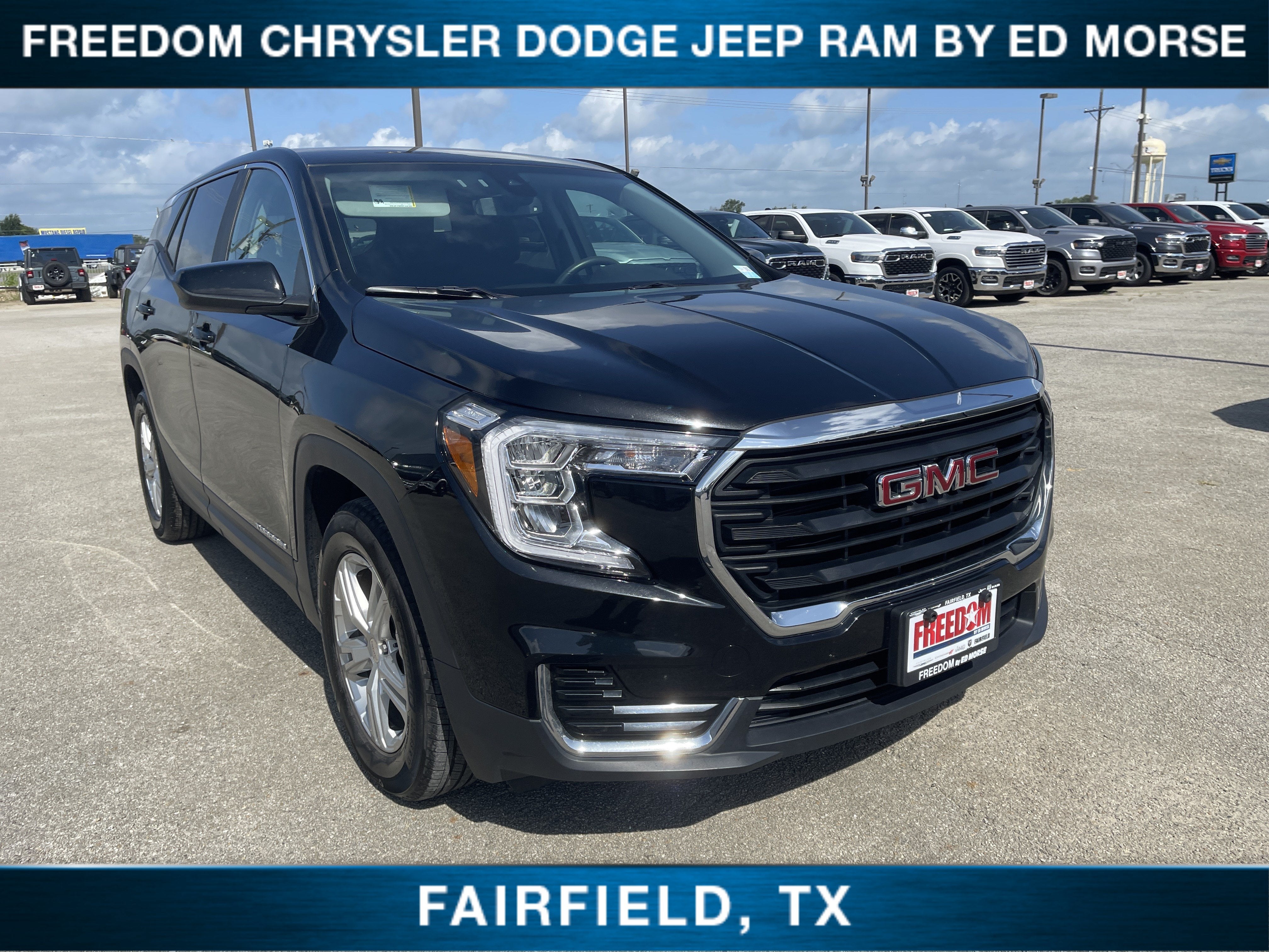 2024 GMC Terrain SLE in Ebony Twilight Metallic — front three-quarter view