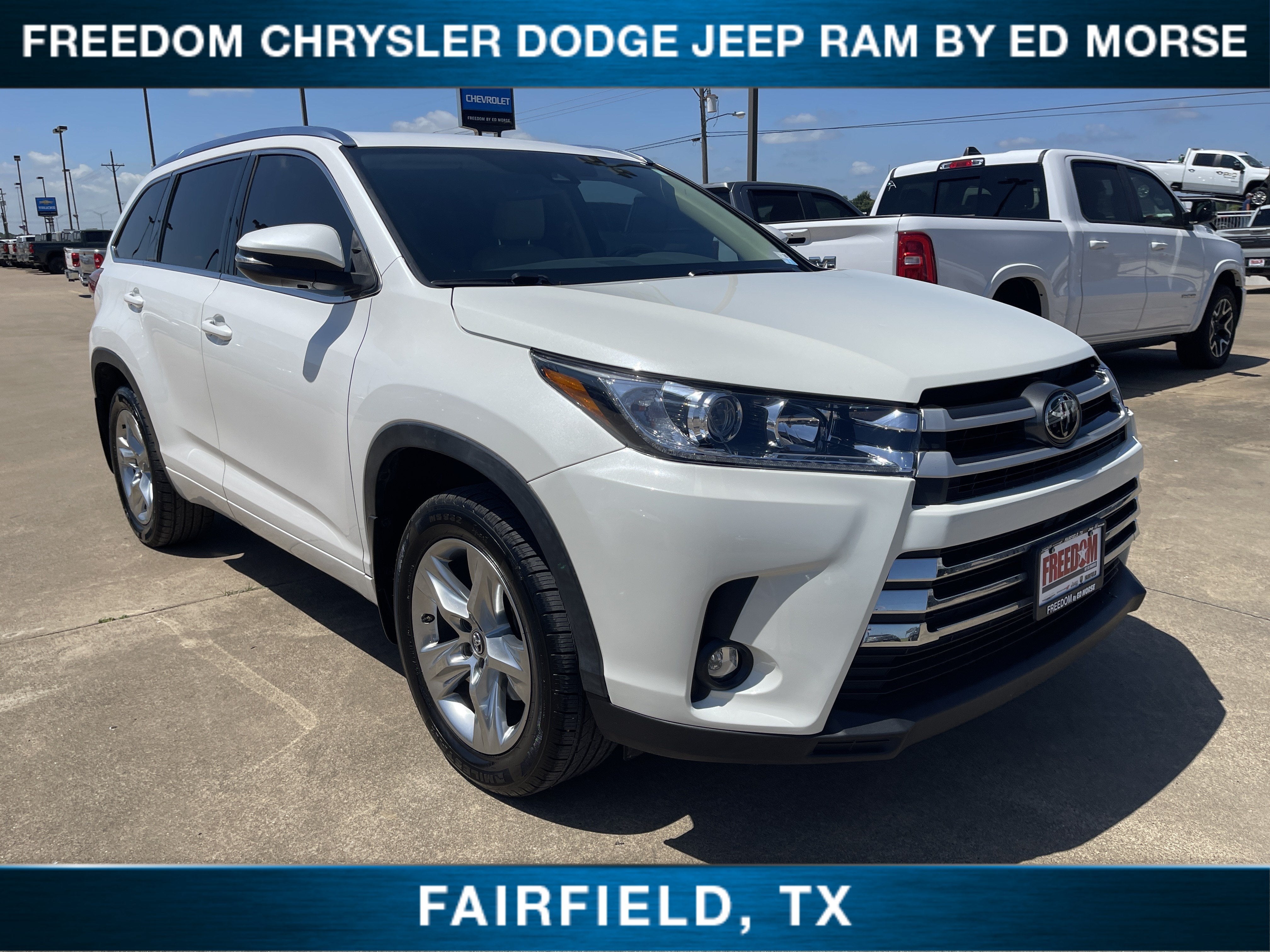 2019 Toyota Highlander Limited in Blizzard Pearl — front three-quarter view
