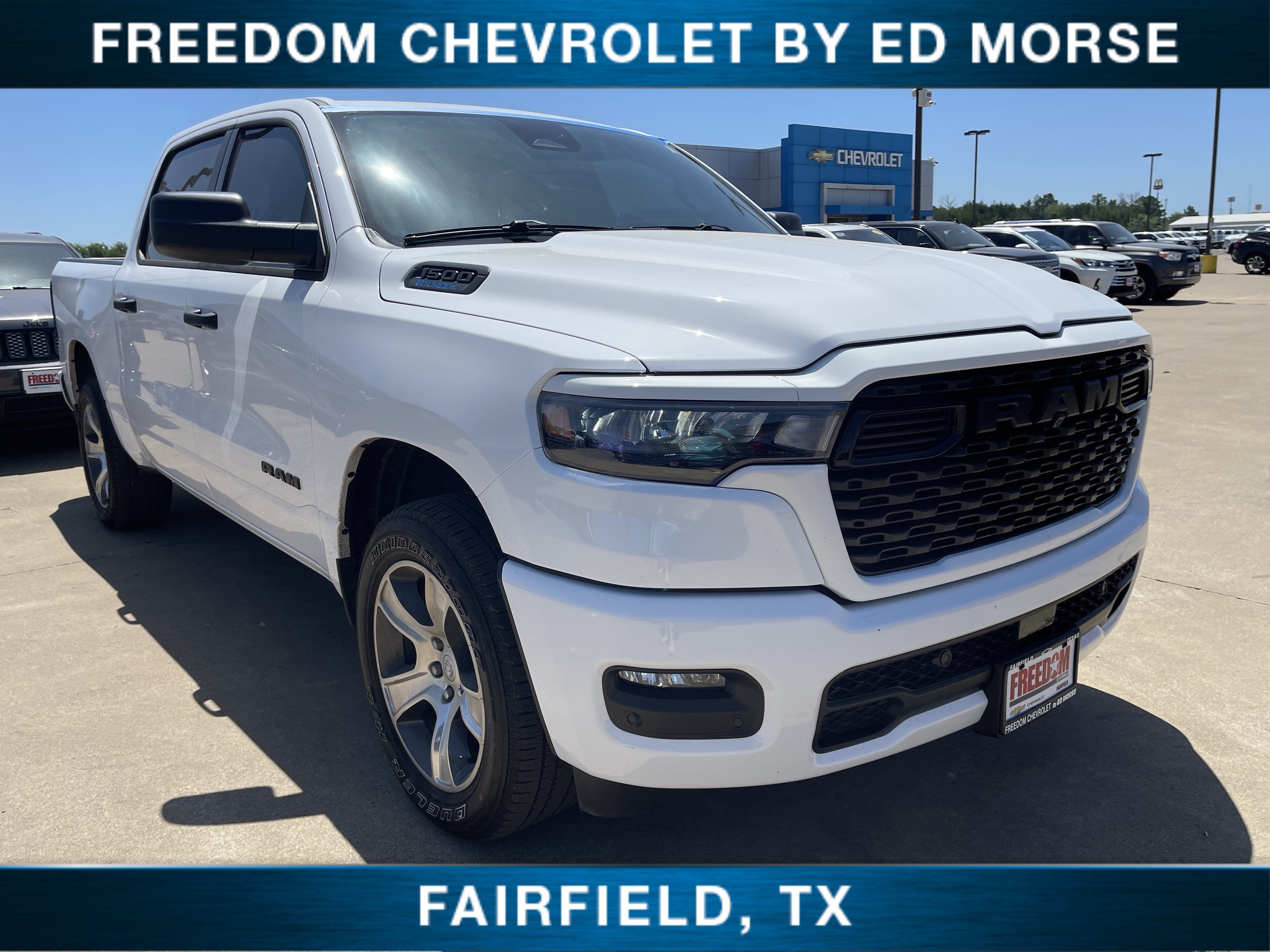 2025 RAM 1500 Tradesman in Bright White Clearcoat — front three-quarter view