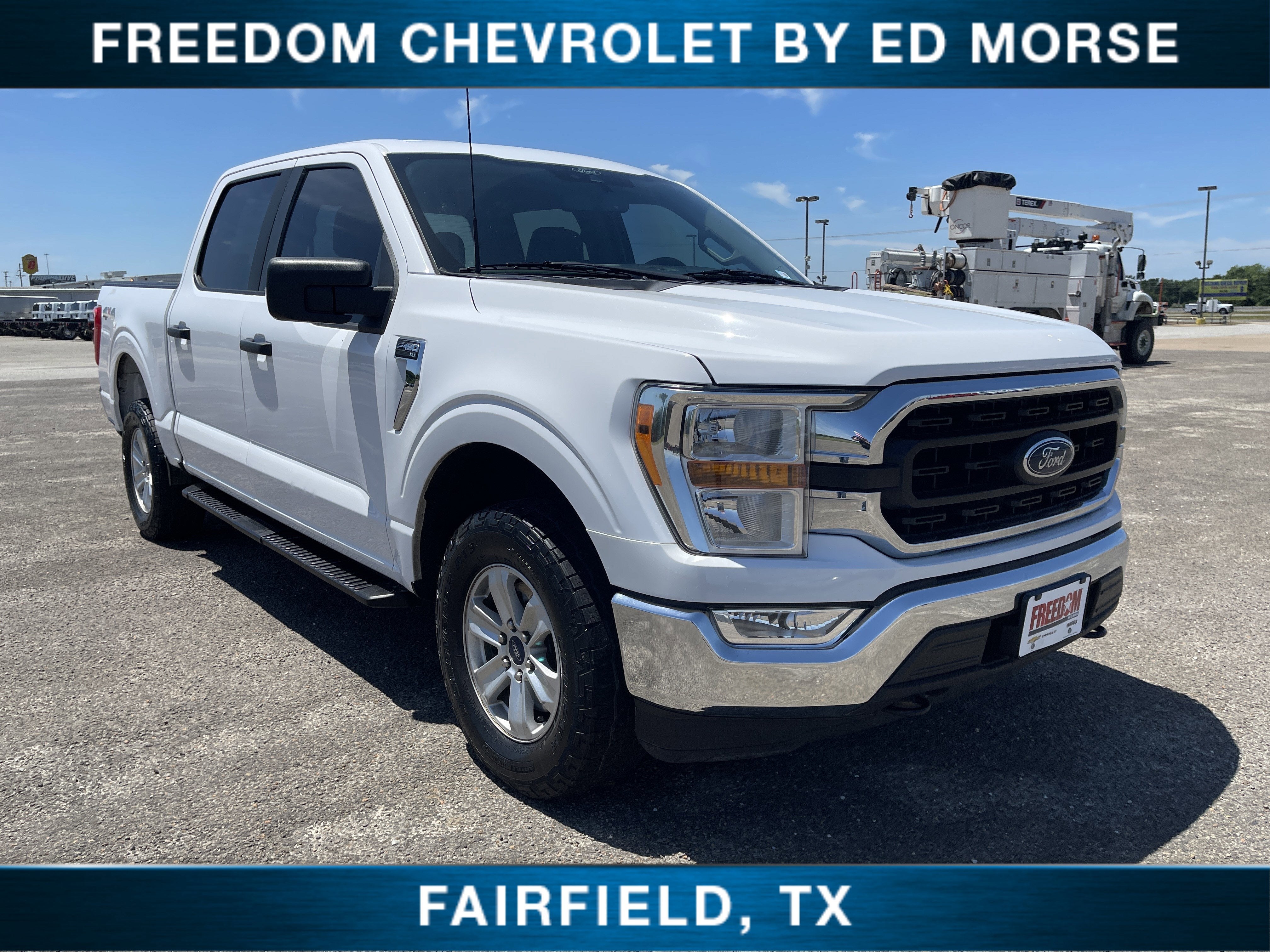 2021 Ford F-150 XLT in Oxford White — front three-quarter view