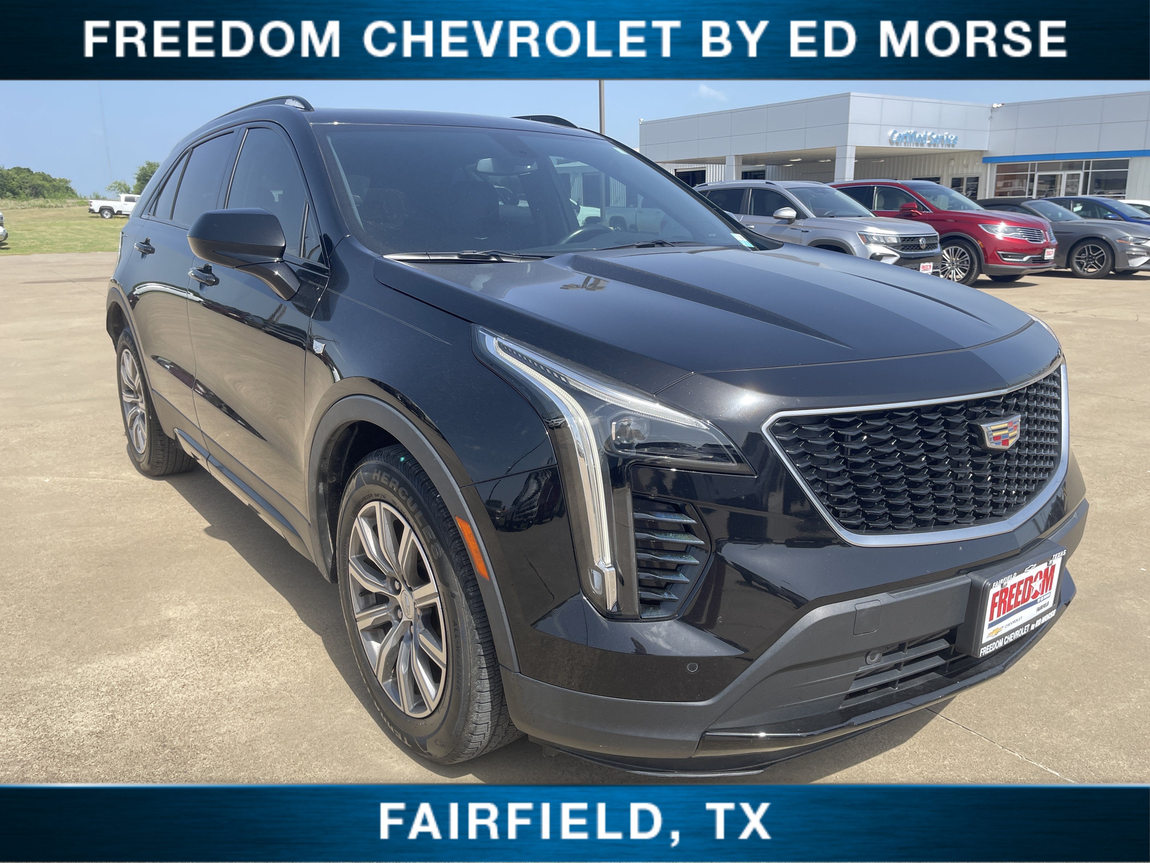 2019 Cadillac XT4 FWD Sport in Stellar Black Metallic — front three-quarter view